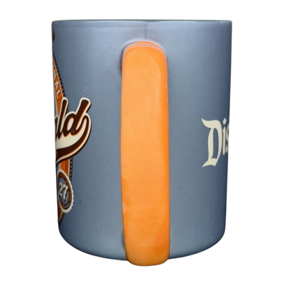 Oswald The Lucky Rabbit Disneyland Resort Mug with vibrant blue design and orange handle