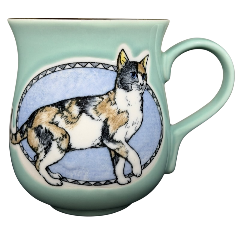 Otagiri calico cat vintage tankard mug featuring a colorful cat illustration on a mint green background