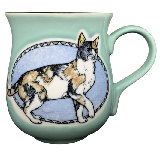 Otagiri calico cat vintage tankard mug featuring a colorful cat illustration on a mint green background