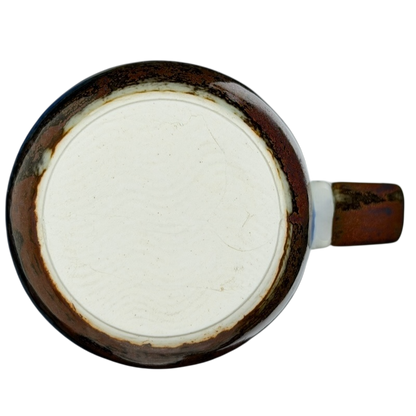 Bottom view of an Otagiri mallard ducks vintage tankard mug showcasing its unique ceramic finish