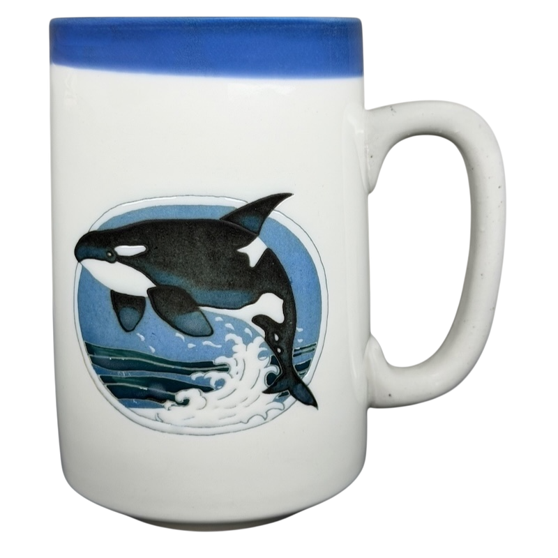 Otagiri orca vintage mug featuring an orca leaping over ocean waves in vibrant colors