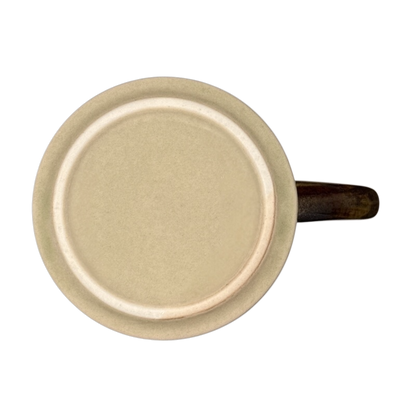 Otagiri vintage white tailed deer mug top view showing beige interior and brown handle on black background