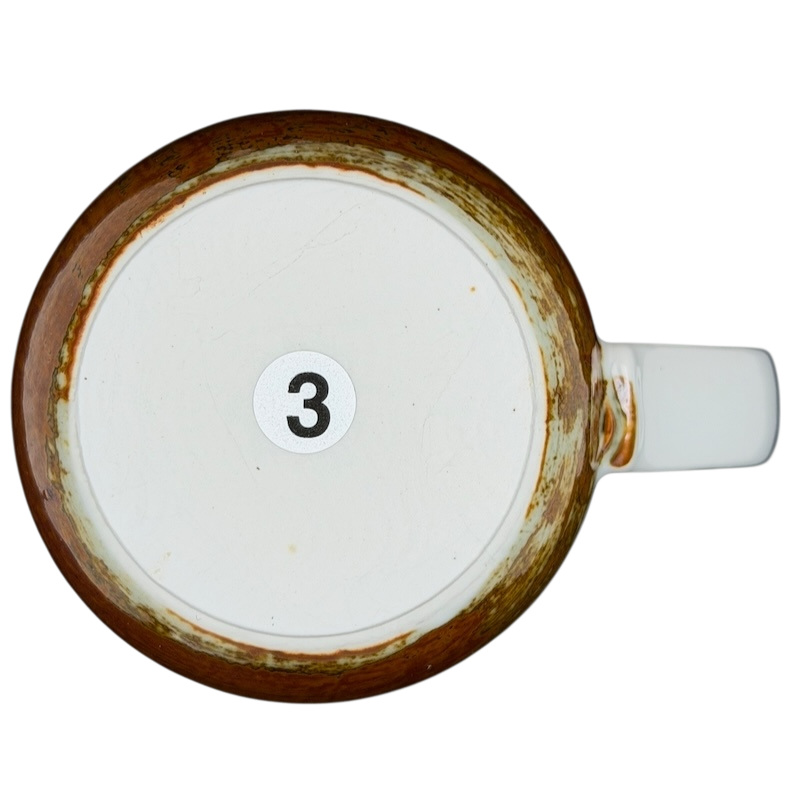 Bottom view of an Otagiri pheasants tankard vintage mug showing the number three and rustic finish