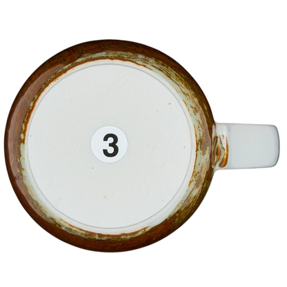 Bottom view of an Otagiri pheasants tankard vintage mug showing the number three and rustic finish