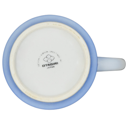 Bottom view of Sailboat Seascape vintage Mug Otagiri showcasing the logo and soft blue rim design