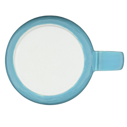 Top view of an Otagiri vintage seagull coastal mug in light blue with a smooth white interior