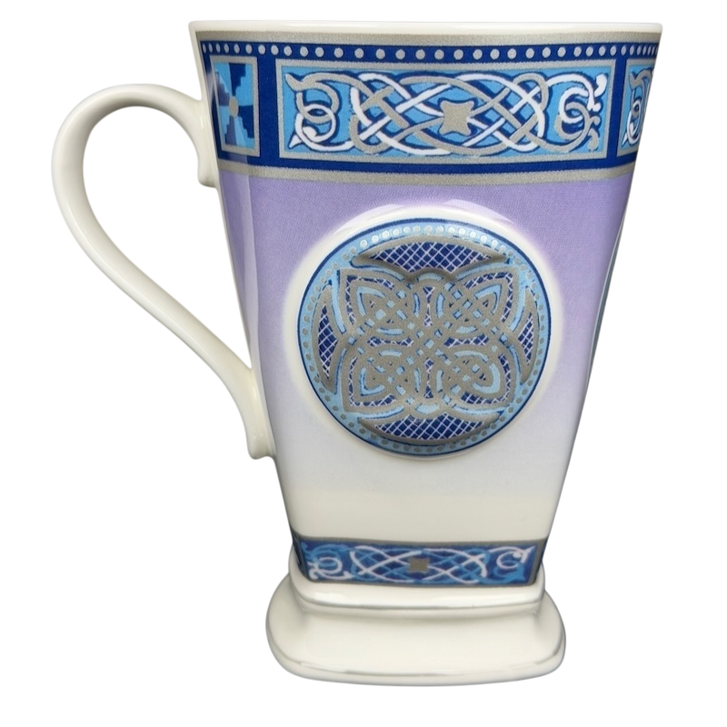 Decorative Celtic mug Past Times collectible with intricate blue and silver designs