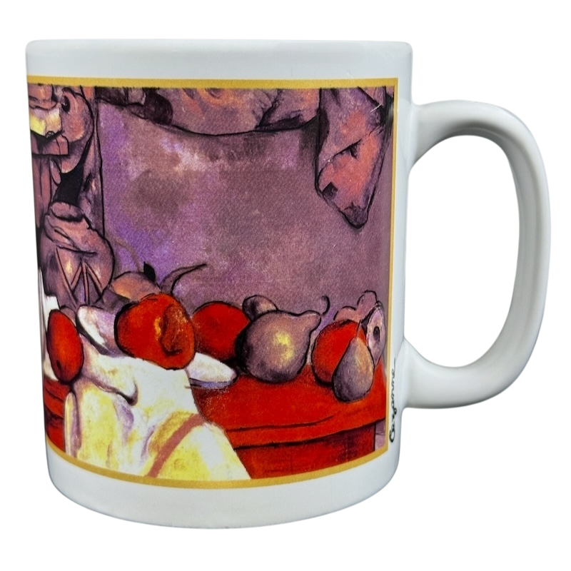 Paul Cezanne still life Cafe Arts vintage mug featuring colorful fruit design on a white background