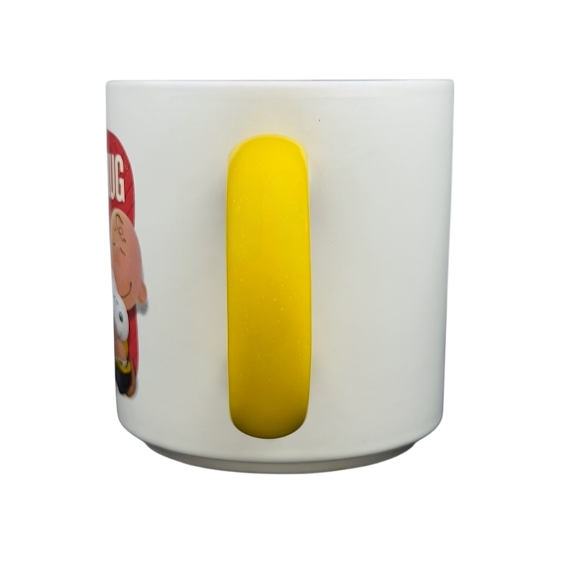 Hallmark Peanuts Movie Charlie Brown Snoopy mug with a yellow handle for fans of the classic cartoon