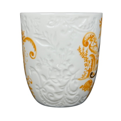 Pier 1 Imports monogram Ava mug K with an elegant floral design in gold and white colors