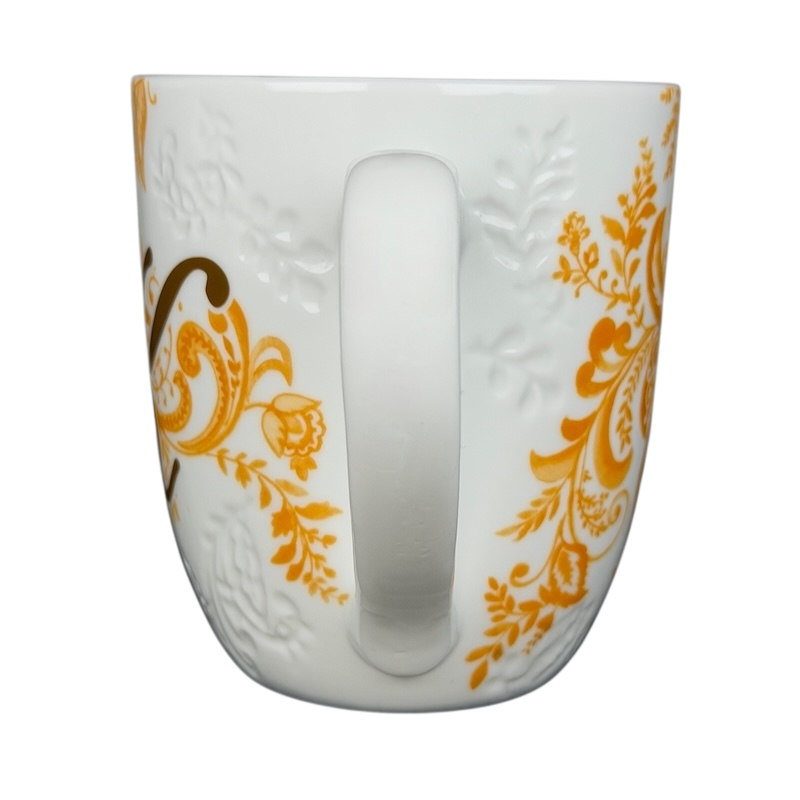 Pier 1 Imports monogram Ava mug K featuring an elegant floral design and a comfortable handle