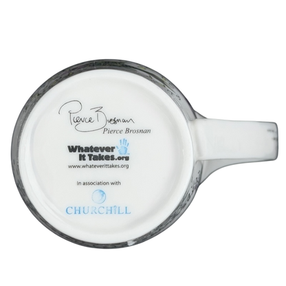 Bottom view of Pierce Brosnan Whatever It Takes mug showing logo and signature on a ceramic surface