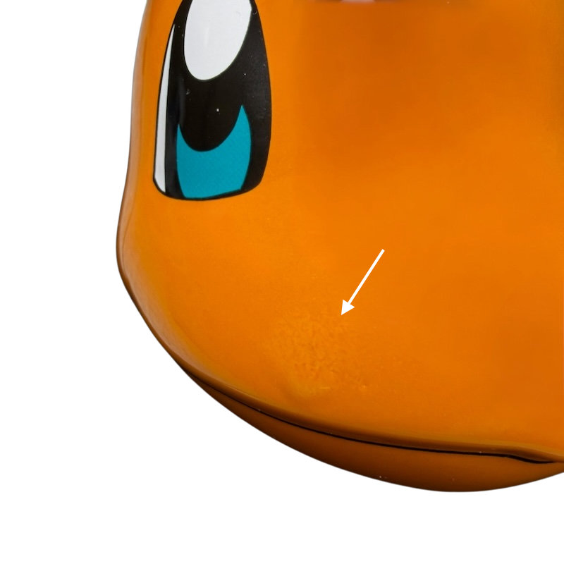 Close-up of the Pokemon Charmander Mug showcasing vibrant colors and playful character design