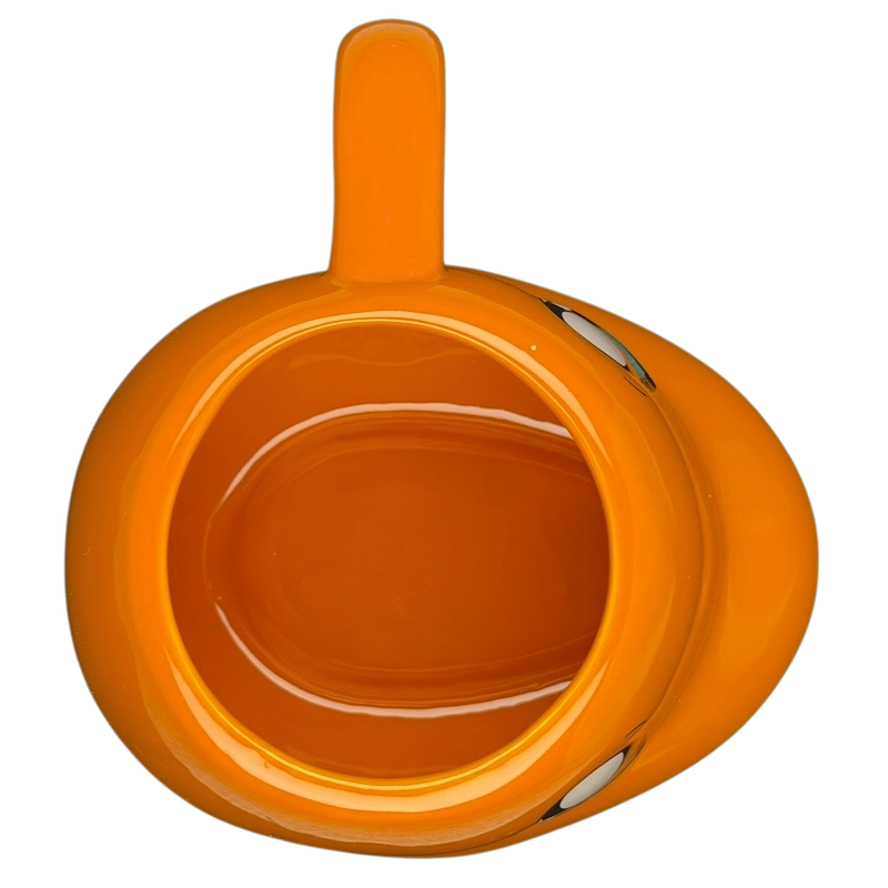 Top view of a bright orange Pokemon Charmander Mug featuring a cute design