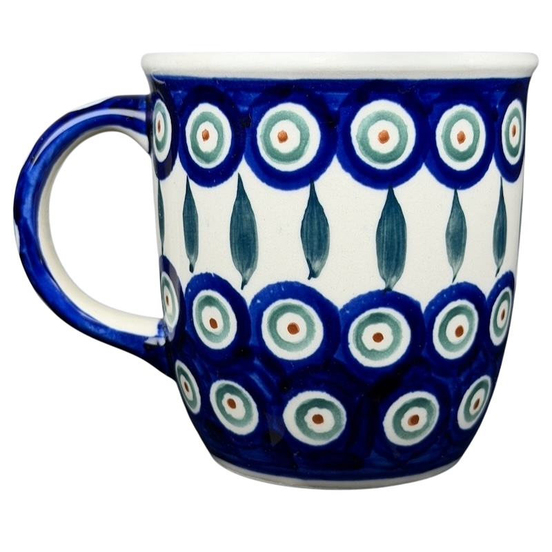 Polish pottery blue peacock eye mug featuring vibrant blue and white floral patterns