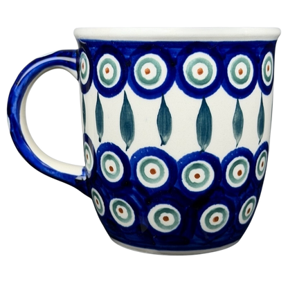 Polish pottery blue peacock eye mug featuring vibrant blue and white floral patterns