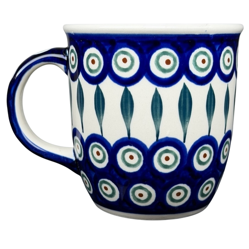 Polish pottery blue peacock eye mug featuring vibrant circular patterns and a sturdy handle