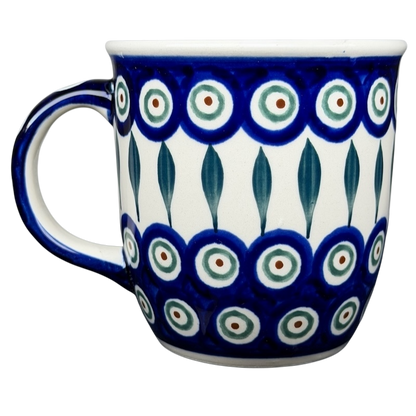 Polish pottery blue peacock eye mug featuring vibrant circular patterns and a sturdy handle
