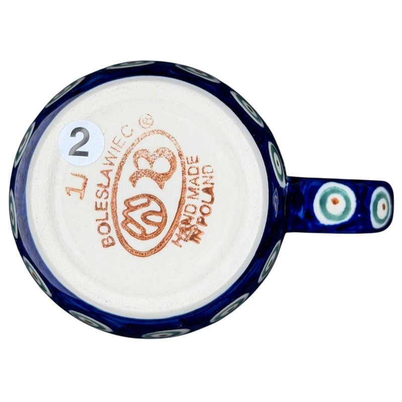 Bottom view of Polish pottery blue peacock eye mug showcasing the artisan craftsmanship and markings