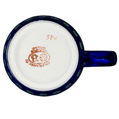 Underside view of a Polish Pottery Boleslawiec Holly Berry Christmas Mug with intricate glaze details