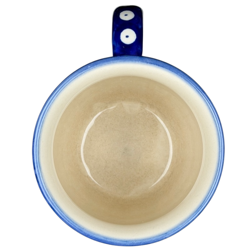 Polish Pottery Boleslawiec Polka Dot Diamond Mug with a blue handle and smooth interior