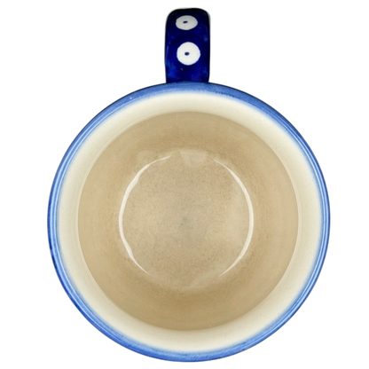 Polish Pottery Boleslawiec Polka Dot Diamond Mug with a blue handle and smooth interior