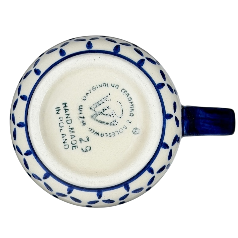 Bottom view of a Polish Pottery Daisy Floral Boleslawiec Mug with handmade markings and decorative pattern