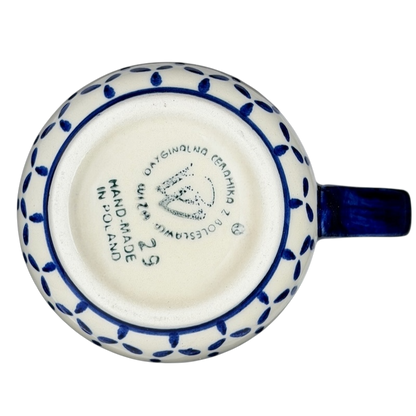 Bottom view of a Polish Pottery Daisy Floral Boleslawiec Mug with handmade markings and decorative pattern