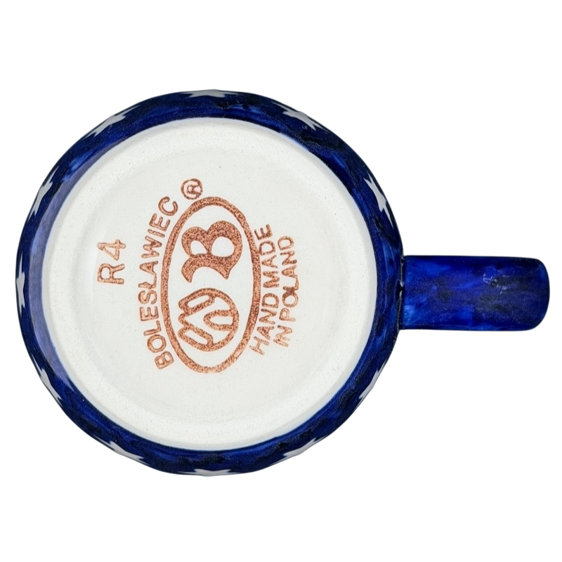 Bottom view of Polish pottery stars and stripes mug showcasing handmade details and blue design