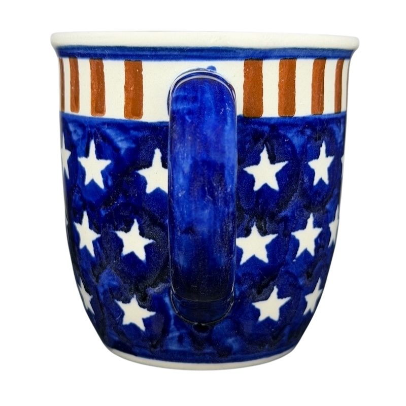 Polish pottery stars and stripes mug featuring a blue background with white stars and red stripes