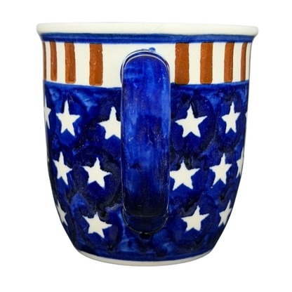 Polish pottery stars and stripes mug featuring a blue background with white stars and red stripes