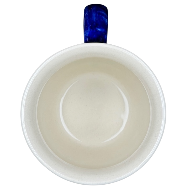 Inside view of Polish pottery stars and stripes mug featuring a smooth interior and blue handle