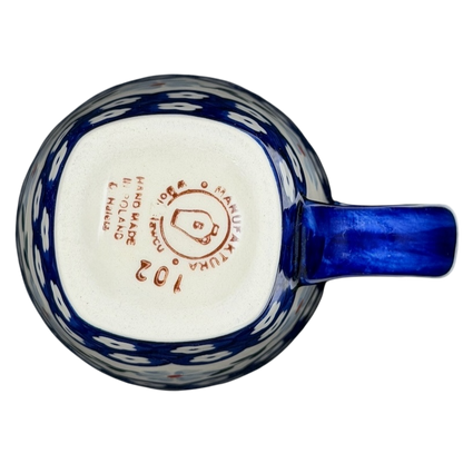 Bottom view of Polish Pottery Tapered Floral Boleslawiec Mug showcasing intricate craftsmanship and design