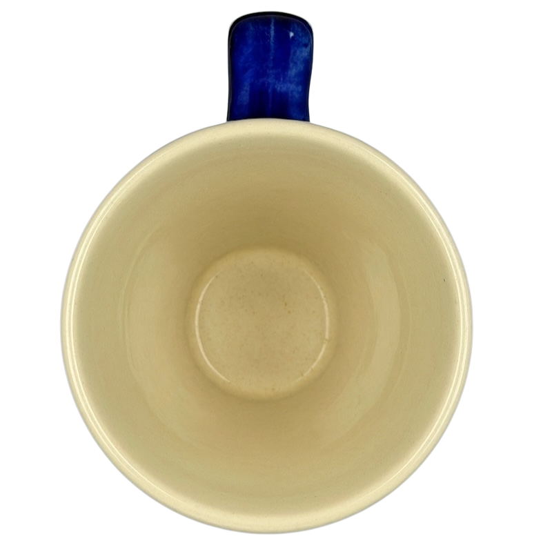 Inside view of Polish Pottery Tapered Floral Boleslawiec Mug showcasing a smooth beige finish