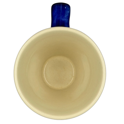 Inside view of Polish Pottery Tapered Floral Boleslawiec Mug showcasing a smooth beige finish