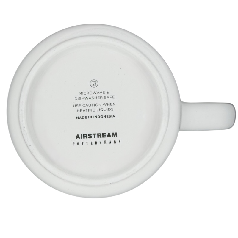 Bottom view of the Airstream Happy Camper Mug Pottery Barn with care instructions and logo