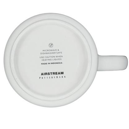 Bottom view of the Airstream Happy Camper Mug Pottery Barn with care instructions and logo