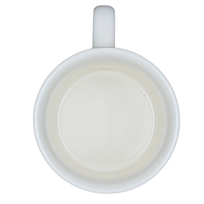 Top view of Airstream Happy Camper Mug Pottery Barn showing a sleek white interior for coffee lovers