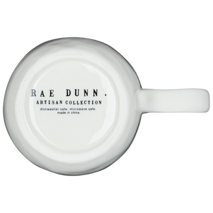 Bottom view of Rae Dunn birdcage mug showing artisan collection details and care instructions