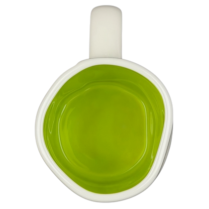 Rae Dunn Buzz Lightyear Pixar Disney mug with a vibrant green interior design