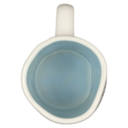 Inside view of Rae Dunn Disney Princess Castle Mug Magenta with smooth blue finish