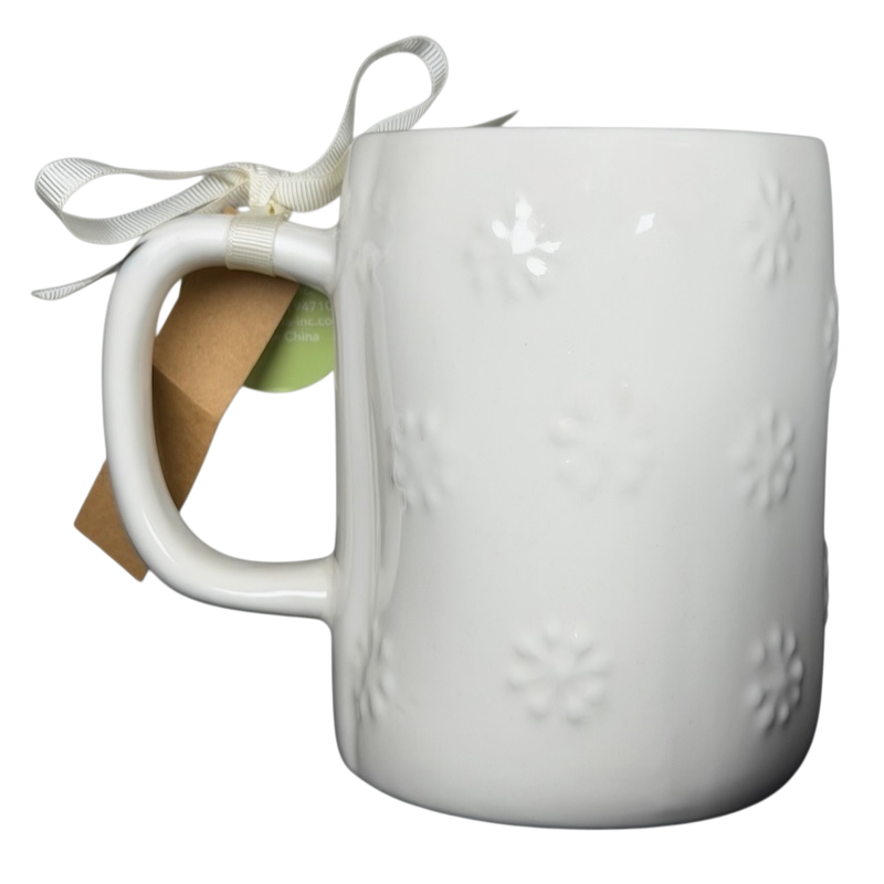 Rae Dunn Merry and Bright collectible mug with embossed floral pattern and ribbon detail