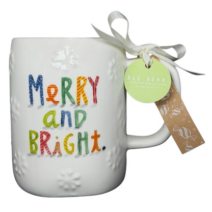 Rae Dunn Merry and Bright collectible mug with colorful lettering and decorative bow