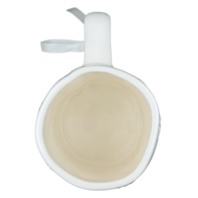 Inside view of Rae Dunn Merry and Bright collectible mug in white ceramic with a smooth finish