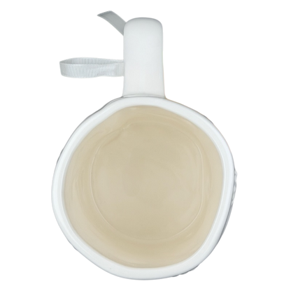 Inside view of Rae Dunn Merry and Bright collectible mug in white ceramic with a smooth finish