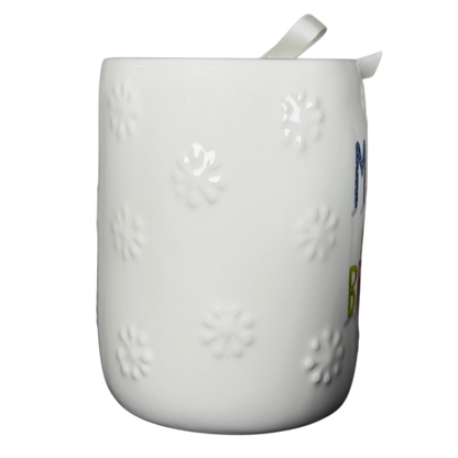 Rae Dunn Merry and Bright collectible mug featuring textured floral designs on a white background