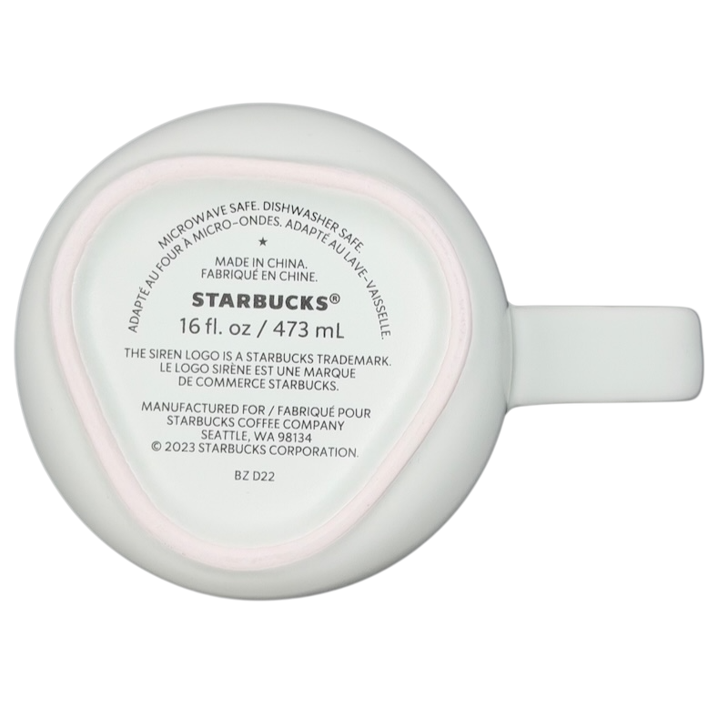 Bottom view of a recycled ceramic Starbucks mug with a 16 fl oz capacity and dishwasher safe label
