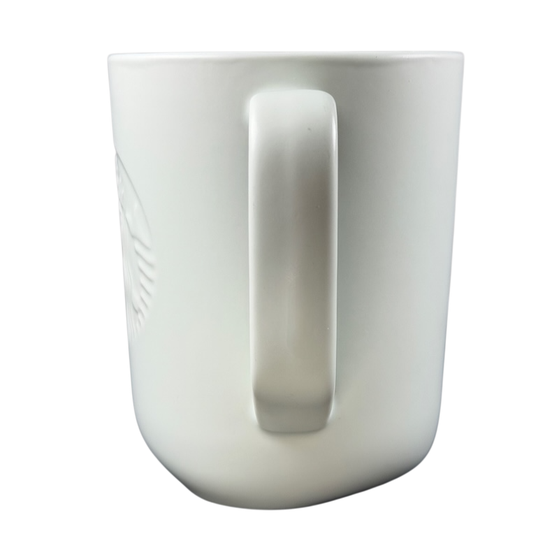 Side view of a recycled ceramic Starbucks mug with a smooth white finish
