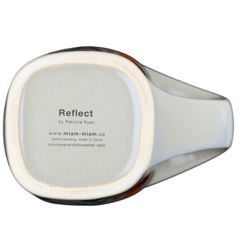 Bottom view of Reflect By Patricia Ryan Miam Miam Mug with care instructions and brand details