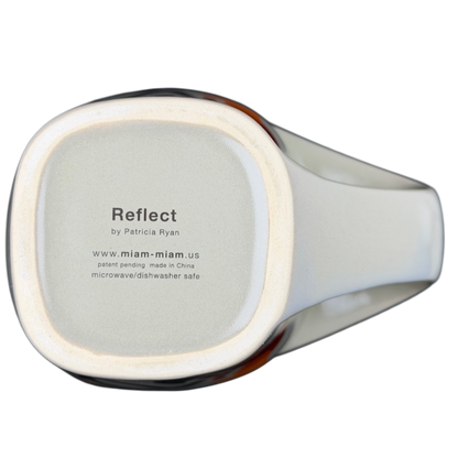 Bottom view of Reflect By Patricia Ryan Miam Miam Mug with care instructions and brand details